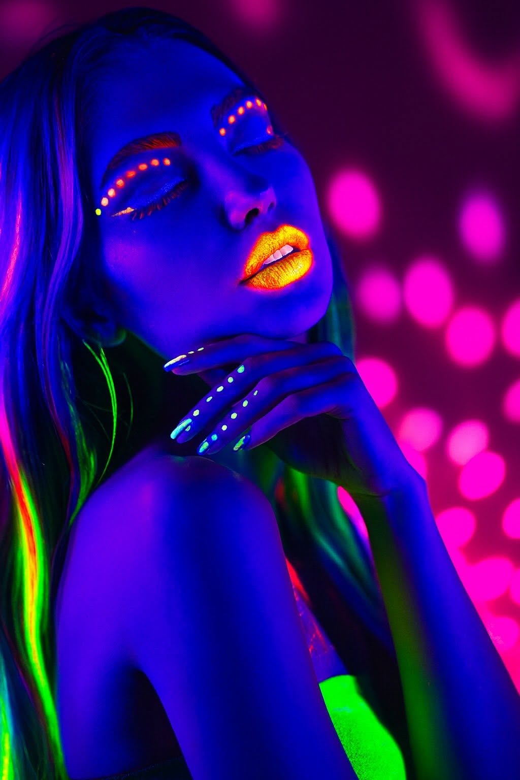 Neon UV beauty portrait, your glow awaits at Love Tan