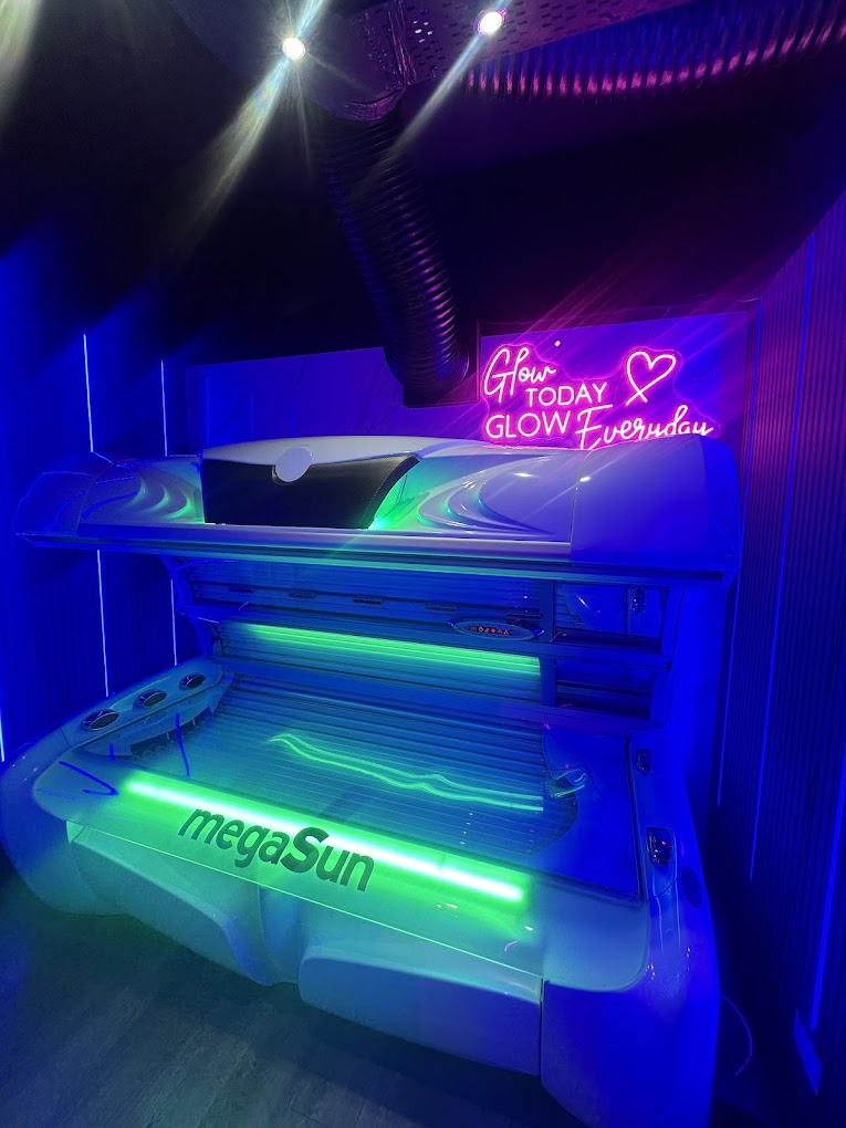 MegaSun Premium lie-down sunbed glowing at Love Tan Warrington